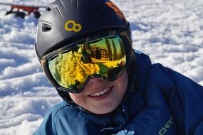 smiling person in ski goggles