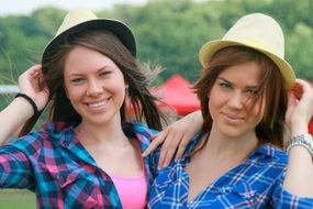 girls in hats smiling