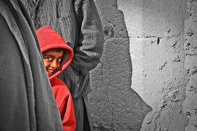 smiling child boy in red jacket