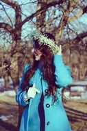 beautiful long haired girl in flower wreath