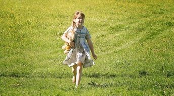 human child in meadow