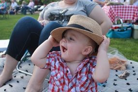 happy toddler in hat outdoor