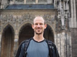 Man with a smile on the building background