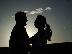 black silhouette of loving couple