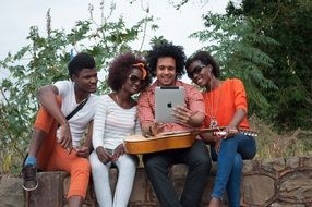 group of young african people with guitar outdoor