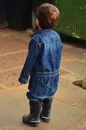back view of toddler boy in jeans