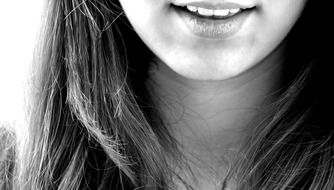 smiling girl in black and white image