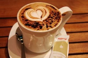 cup of cappuccino with heart on the froth