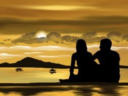 couple in love by the lake on a background of yellow sunset