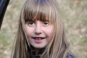 pretty caugasian child girl face, outdoor portrait