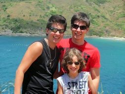 three brothers on the background of the reservoir in Brazil