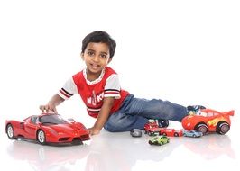 boy playing with toy cars