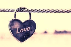 lock in the shape of a heart with the text love