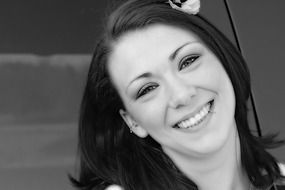 black and white portrait of a smiling girl