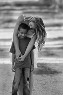 Black and white photo of the girl and boy