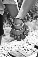 hold hands on black and white