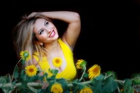 beautiful smiling woman on the background of sunflowers