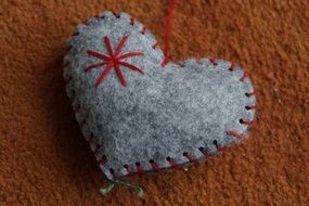 closeup picture of handmade heart of felt