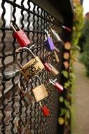 Side view of a fence with locks of love