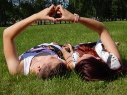 Couple lying on a grass