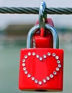 red lock with heart crystals