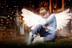 Blonde Girl with angel wings with teddy bear