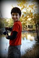 Happy boy is fishing
