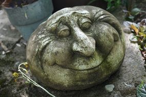 smiling decorative face for a garden