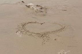 Drawed heart on the sand