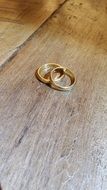 Gold wedding rings on the floor