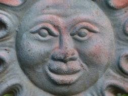 carved sun close up