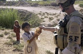 child gives the soldier grapes