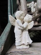 angels kissing statue