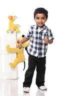 happy boy with soft toys