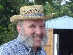 Happy man with grey fuzzy beard