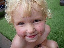 dirty faced blond child portrait