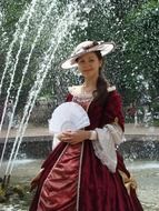 woman in vintage dress near the fountain