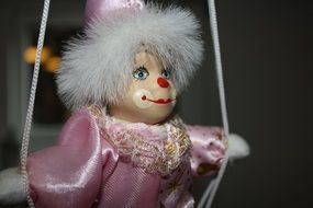 clown doll in a pink costume