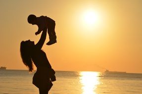 mother and daughter in the sunset light