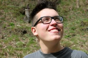 teenager in glasses with a smile