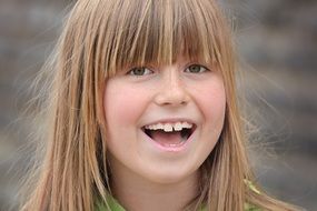 little girl laughing at the photo