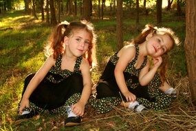 cute twin sisters outdoor