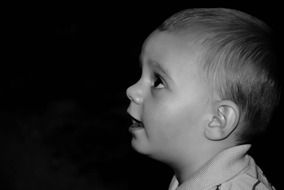 Black and white photo of a cute boy
