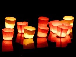 orange candles on a black background