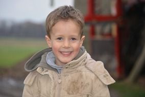happy boy in a jacket