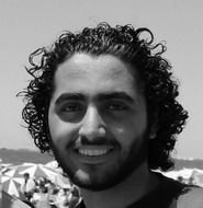 black and white portrait of a smiling young man