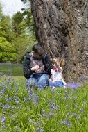 father and daughter on a flowering meadow