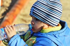 a kid drinking water
