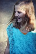 happy girl in blue blouse