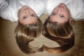 two friends lie on the floor